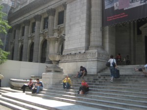 Steps to the 6th Avenue entrance of the New York Public Library. Just across the street, Jon and Mara have a fateful encounter with a certain assassin.
